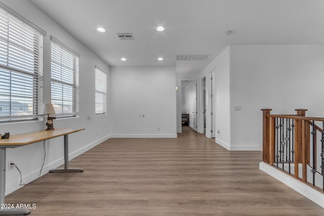 spare room with light hardwood / wood-style flooring