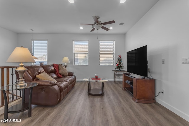 living room with ceiling fan, a healthy amount of sunlight, and hardwood / wood-style floors