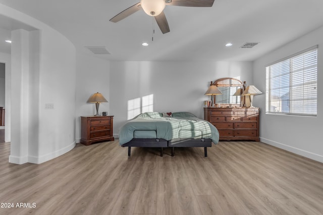 bedroom with ceiling fan and light wood-type flooring