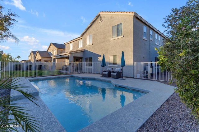 view of swimming pool featuring outdoor lounge area and a patio