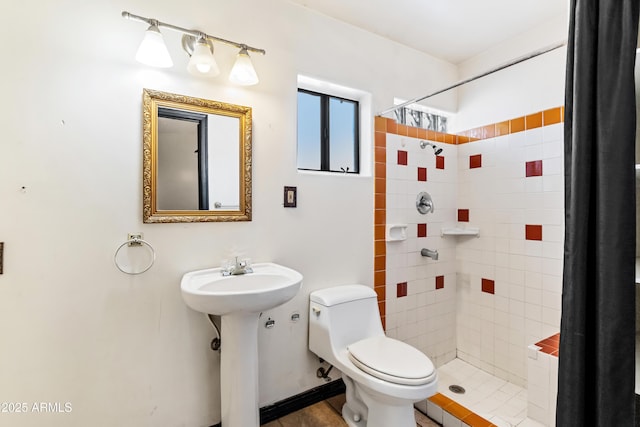 bathroom featuring a shower stall and toilet