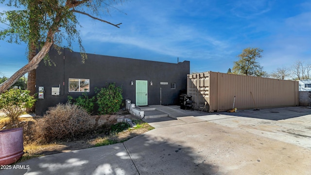 exterior space with stucco siding