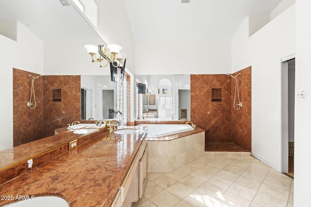 bathroom with independent shower and bath, a high ceiling, and tile patterned floors