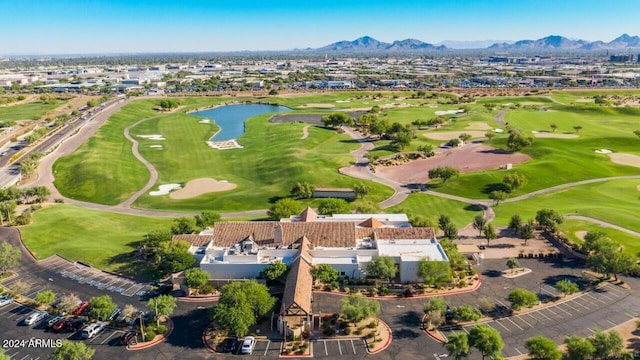 drone / aerial view featuring a water and mountain view