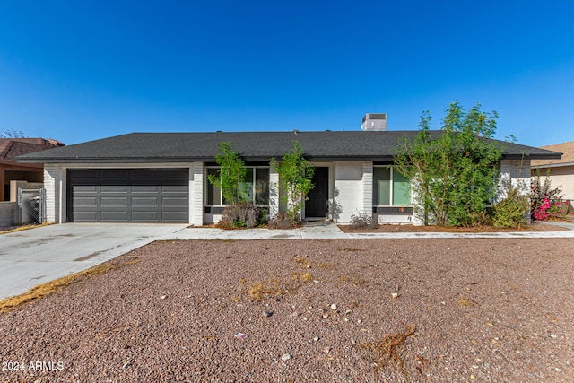 single story home with a garage