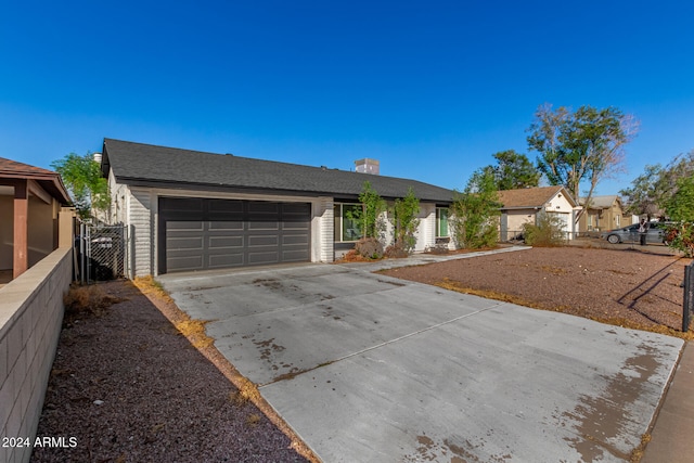 ranch-style house featuring a garage