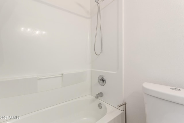 bathroom featuring toilet and shower / bathing tub combination