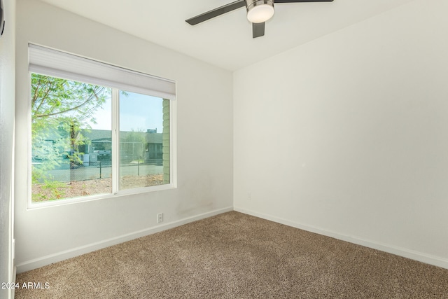 empty room featuring carpet and ceiling fan