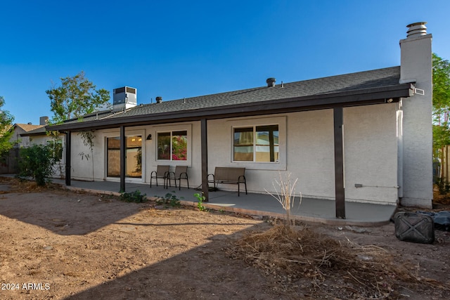 rear view of house featuring a patio