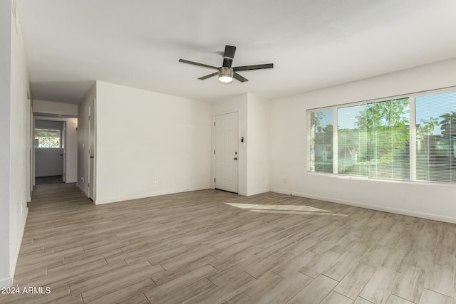 unfurnished room with light hardwood / wood-style floors and ceiling fan