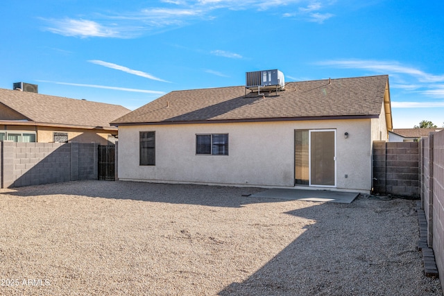 back of property featuring central AC unit and a patio