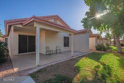 back of house with a patio