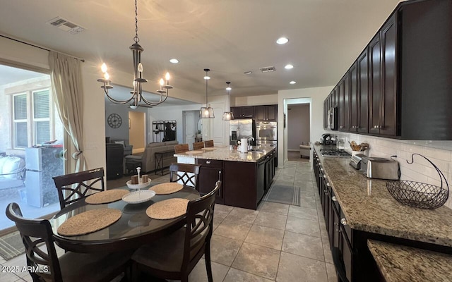 dining area with recessed lighting, visible vents, a chandelier, and light tile patterned floors