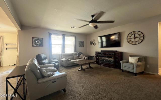 tiled living area featuring carpet, a ceiling fan, and visible vents