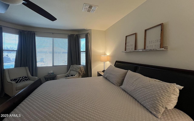 bedroom with visible vents, ceiling fan, and vaulted ceiling