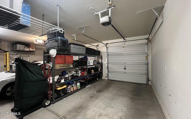 garage with a garage door opener and baseboards