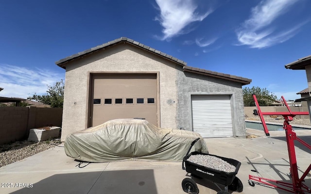 garage with fence