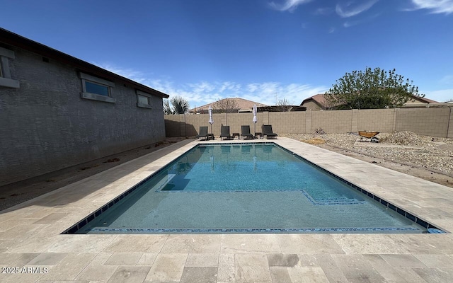 view of swimming pool with a fenced in pool, a patio, and a fenced backyard