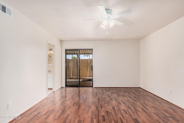 927 E Charleston Ave, Phoenix, AZ 85022 - spare room featuring wood finished floors, ceiling fan, and baseboards
