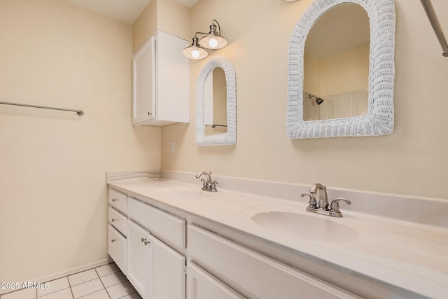 927 E Charleston Ave, Phoenix, AZ 85022 - bathroom featuring double vanity, tile patterned floors, and baseboards