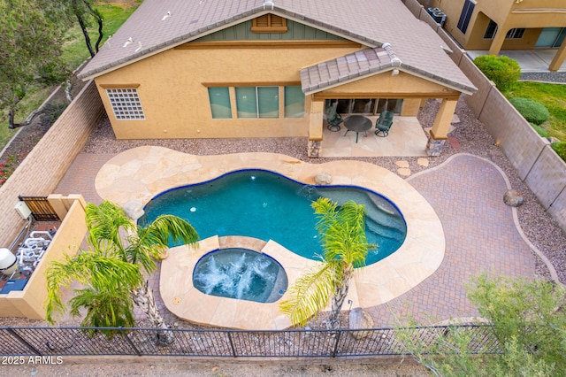 12702 W Dove Wing Way, Peoria, AZ 85383 - view of swimming pool with a patio, a fenced backyard, an in ground hot tub, and a fenced in pool
