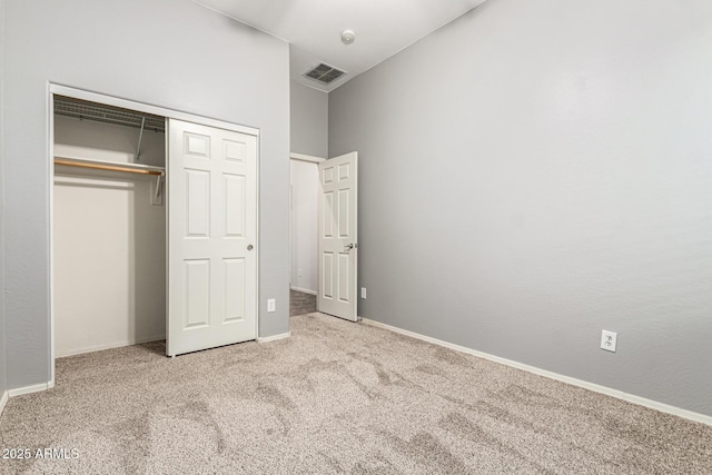 12702 W Dove Wing Way, Peoria, AZ 85383 - unfurnished bedroom with baseboards, carpet, a closet, and visible vents