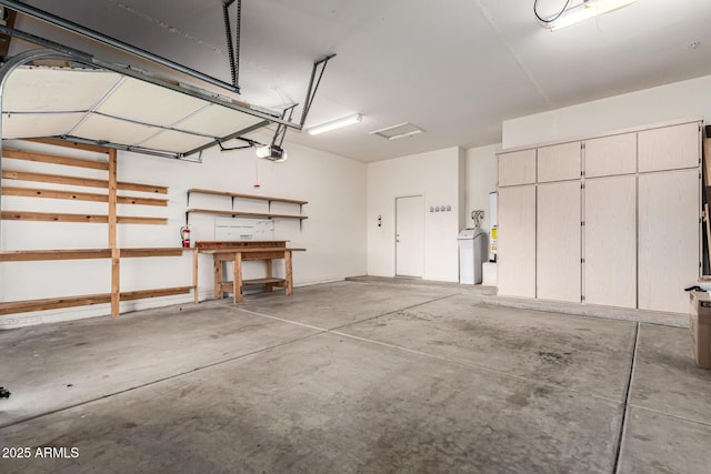 12702 W Dove Wing Way, Peoria, AZ 85383 - garage featuring a workshop area and a garage door opener