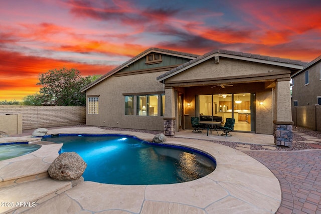 12702 W Dove Wing Way, Peoria, AZ 85383 - rear view of property with stucco siding, a fenced backyard, a fenced in pool, a patio area, and a ceiling fan