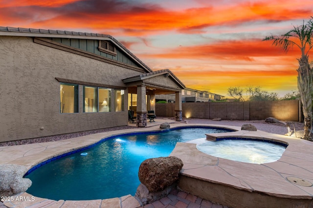 12702 W Dove Wing Way, Peoria, AZ 85383 - view of pool featuring an in ground hot tub, a fenced in pool, a fenced backyard, and a patio area