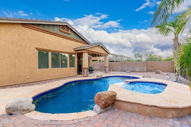 12702 W Dove Wing Way, Peoria, AZ 85383 - view of pool featuring a patio, an in ground hot tub, a fenced in pool, and a fenced backyard