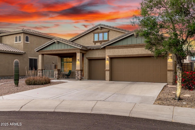 12702 W Dove Wing Way, Peoria, AZ 85383 - craftsman house featuring covered porch, stucco siding, board and batten siding, concrete driveway, and an attached garage