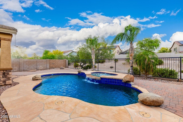 12702 W Dove Wing Way, Peoria, AZ 85383 - view of pool featuring an in ground hot tub, a fenced in pool, a fenced backyard, and a patio area