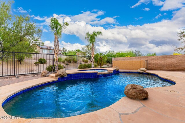 12702 W Dove Wing Way, Peoria, AZ 85383 - view of pool featuring a fenced in pool, a fenced backyard, and an in ground hot tub