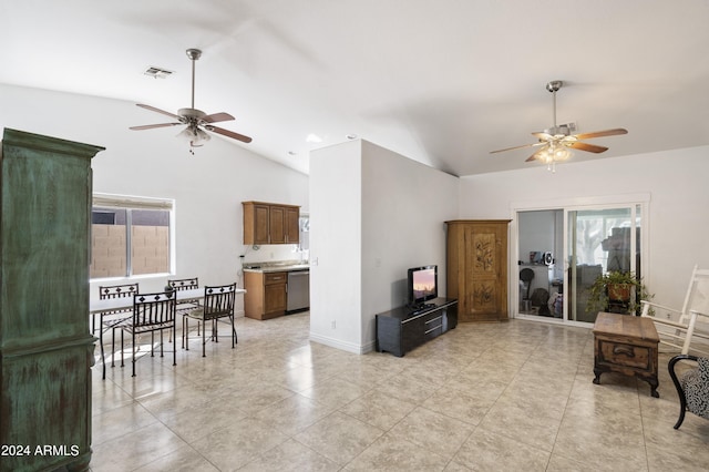 tiled living room featuring ceiling fan and lofted ceiling