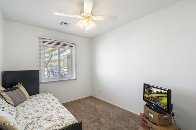 living area featuring ceiling fan and carpet floors