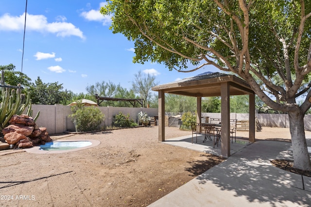 exterior space featuring a patio area and a gazebo