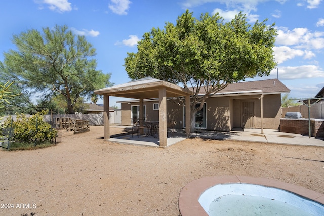 back of house with a patio area