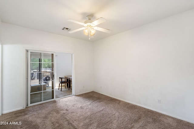 empty room with carpet and ceiling fan