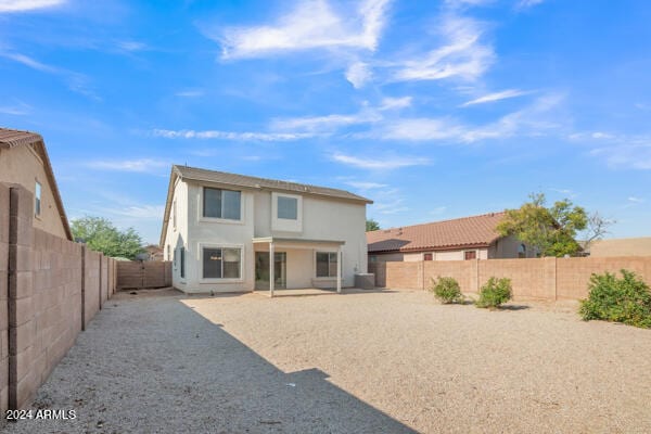 back of house with a patio