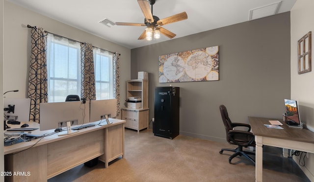 office space with visible vents, baseboards, and ceiling fan