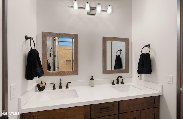 full bathroom featuring double vanity and a sink