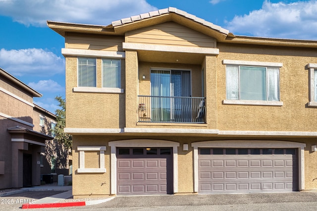 townhome / multi-family property featuring a garage