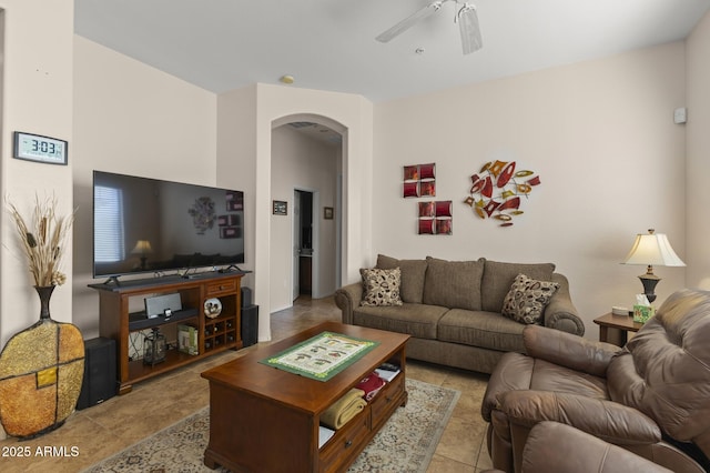 living room featuring light tile patterned floors and ceiling fan