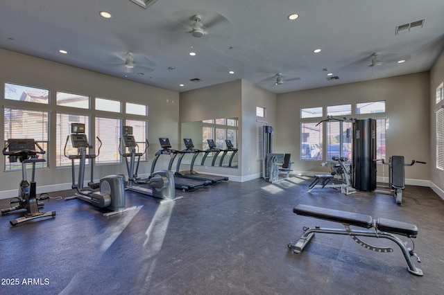 exercise room with ceiling fan