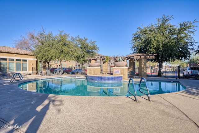 view of pool with a patio and a pergola