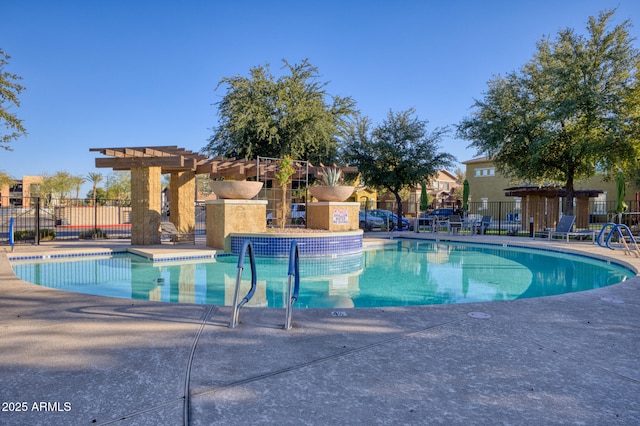 view of swimming pool featuring a pergola