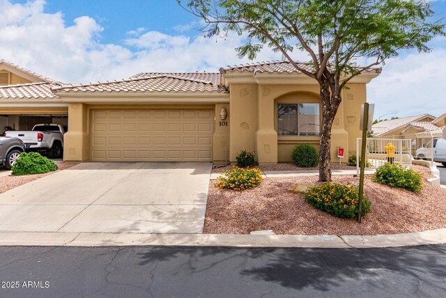 5830 E Mckellips Rd Unit 101, Mesa, AZ 85215 - view of front facade with an attached garage, stucco siding, concrete driveway, and a tile roof