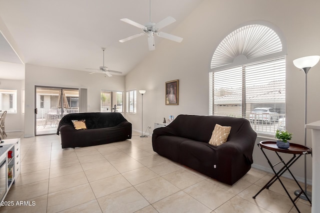 5830 E Mckellips Rd Unit 101, Mesa, AZ 85215 - living room featuring ceiling fan, high vaulted ceiling, baseboards, and light tile patterned flooring
