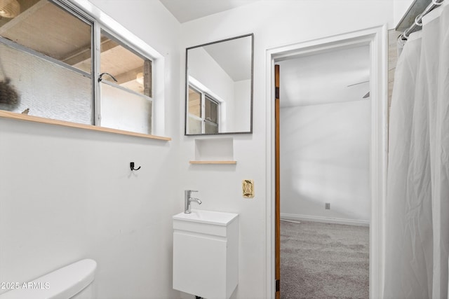 bathroom featuring toilet and a sink