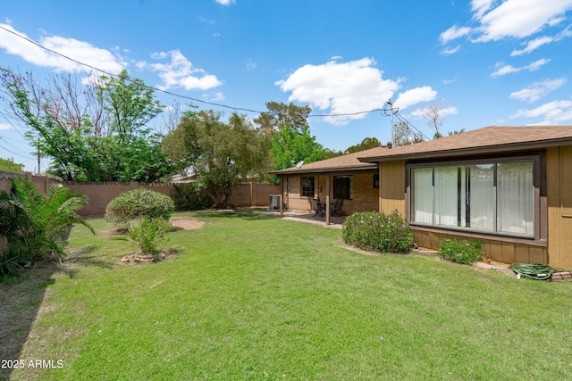 view of yard with a patio and a fenced backyard